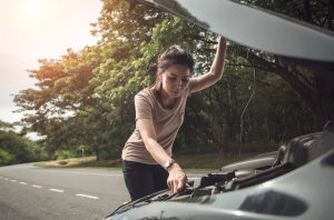 Woman with hood of car open | Bowie, MD | 